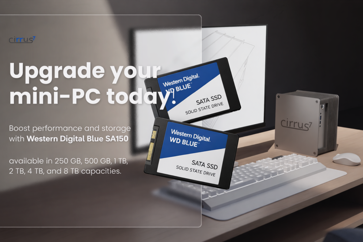 Cirrus7 Mini-PC auf einem Schreibtisch mit schwebenden Western Digital Blue SATA SSDs vor einem Monitor